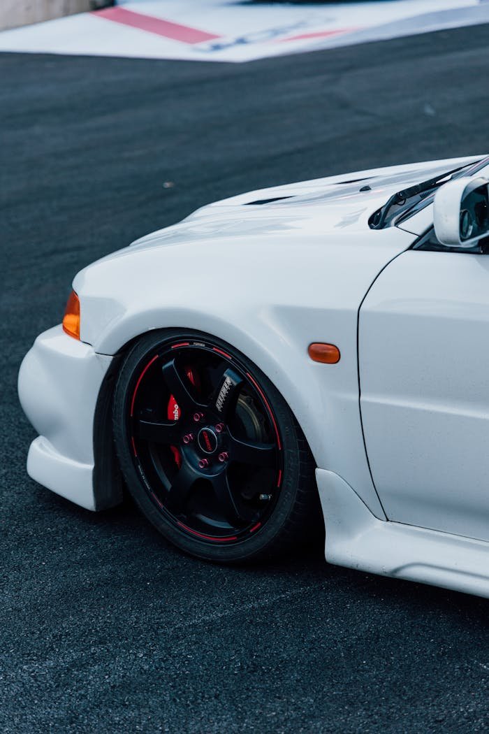 White Mitsubishi Lancer Evolution on the Race Track